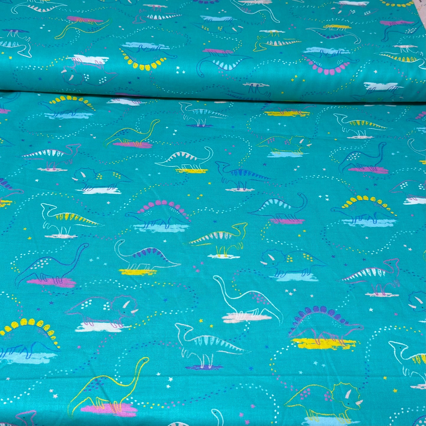 Playful Dino Trails Print Fabric - 100% Cotton | 45” Wide