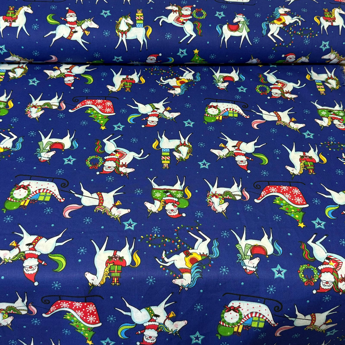 Christmas Santa & Unicorns on Royal Blue Print Fabric – 100% Cotton | 45” Wide