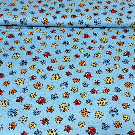 Playful Ladybug Toss Quilting Fabric – Blue Background | 100% Cotton | 45” Wide