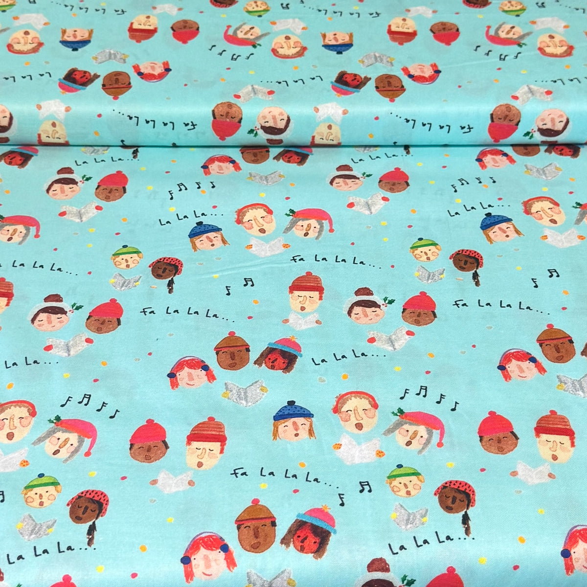 Christmas Carolers on Aqua Print Fabric – 100% Cotton | 45” Wide